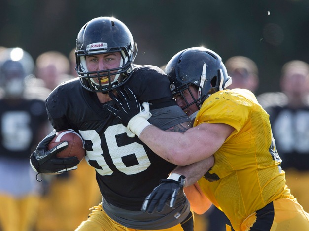 Iowa Hawkeyes tight end C.J. Fiedorowicz (86) is hit by linebacker James Morris (44) after catching a pass during the team's 12th Outback Bowl Practice Thursday, Dec. 26, 2013 in Tampa. (Brian Ray/hawkeyesports.com)