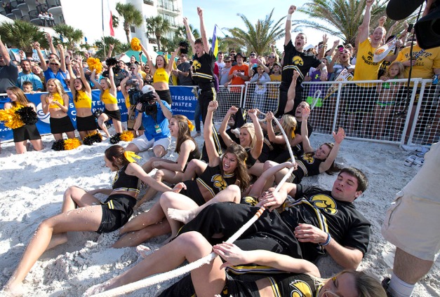 The Iowa Hawkeyes cheerleaders celebrate after defeating the LSU cheerleaders in a tug-o-war during the Outback Bowl beach day Monday, Dec. 30, 2013 in Clearwater Beach, FL.  (Brian Ray/hawkeyesports.com)