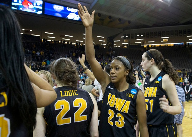 Iowa Hawkeyes guard Theairra Taylor (23) waves to the fans one last time following their game against the Louisville Cardinals in the second round of the 2014 NCAA Women's Basketball Tournament  Tuesday, March 25, 2014 at Carver-Hawkeye Arena in Iowa City.  (Brian Ray/hawkeyesports.com) 